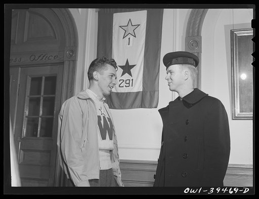 Washington, D.C. Walter Spangenberg, a student at Woodrow Wilson High School, who has an appointment to Annapolis, talking with a Wilson graduate who is now in the Navy