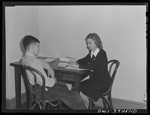 Washington, D.C. Public health nurse checking the findings of the Woodrow Wilson High School nurse