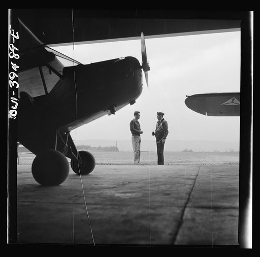 Frederick, Maryland. Walter Spangenberg, a student at Woodrow Wilson High School, talking to a friend at the Stevens Airport where he takes lessons