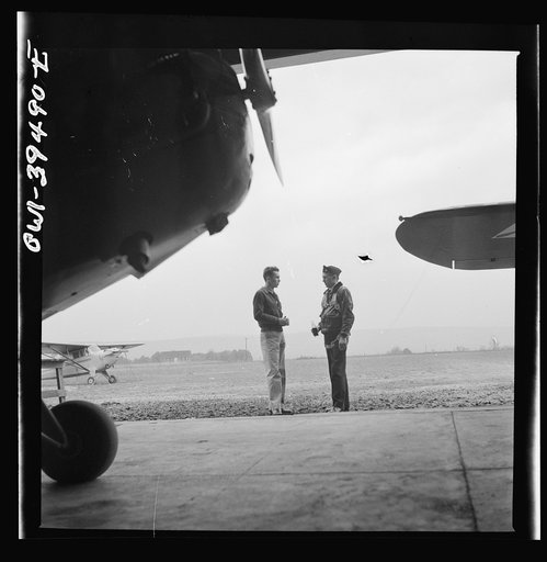 Frederick, Maryland. Walter Spangenberg, a student at Woodrow Wilson High School, talking to a friend at the Stevens Airport where he takes flying lessons