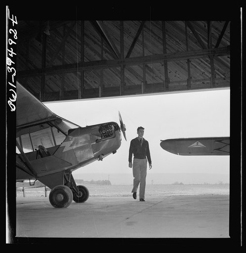 Frederick, Maryland. Walter Spangenberg, student at Woodrow Wilson High School, entering the hanger at the Stevens Airfield, where he is learning to fly