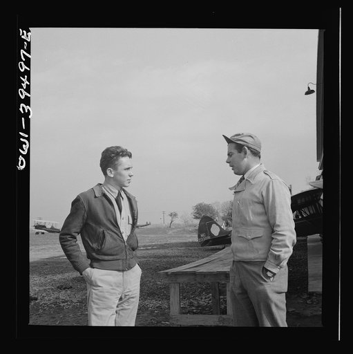 Untitled photo, possibly related to: Frederick, Maryland. After a solo flight, Walter Spangenberg, a student at Woodrow Wilson High School, listens to a criticism from his instructor at Stevens Airport