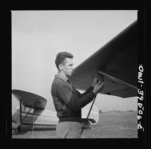 Frederick, Maryland. Returning from a practice flight at Stevens Airport, Walter Spangenberg, a student at Woodrow Wilson High School, ties down his plane