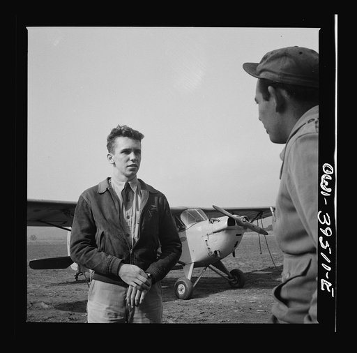 Frederick, Maryland. After a solo flight, Walter Spangenberg, a student at Woodrow Wilson High School, listens to a criticism from his instructor at Stevens Airport