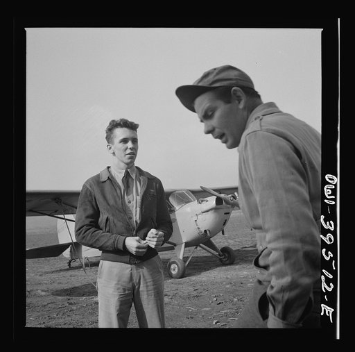 Frederick, Maryland. After a solo flight, Walter Spangenberg, a student at Woodrow Wilson High School, listens to a criticism from his instructor at Stevens Airport