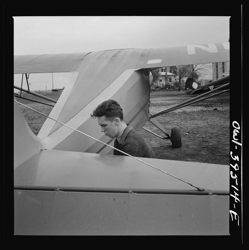 Frederick, Maryland. Returning from a practice flight at Stevens Airport, Walter Spangenberg, a student at Woodrow Wilson High School, ties down his plane