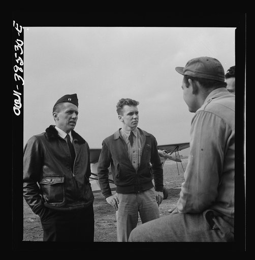 Frederick, Maryland. Walter Spangenberg, a student at Woodrow Wilson High School, listening to an instructor at the airport