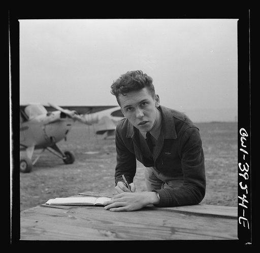 Frederick, Maryland. Walter Spangenberg, a student at Woodrow Wilson High School, filling out his pilot's log book after a solo flight at the Stevens Airport