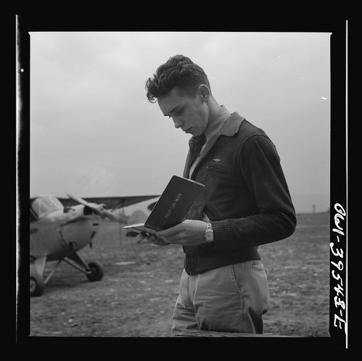 Frederick, Maryland. Walter Spangenberg, a student at Woodrow Wilson High School, filling out his pilot's log book after a solo flight at the Stevens Airport