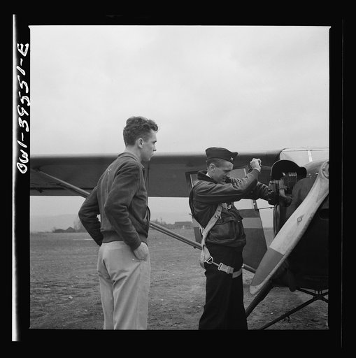 Frederick, Maryland. Walter Spangenberg, a student at Woodrow Wilson High School, watching another student get ready to take off at the Stevens Airport