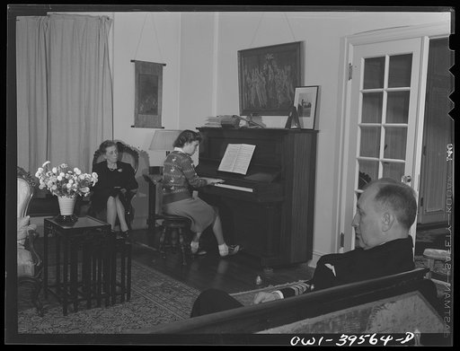 Washington, D.C. Sally Dessez, a student at Woodrow Wilson High School, playing the piano at home