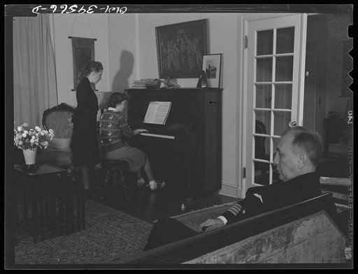 Washington, D.C. Sally Dessez, a student at Woodrow Wilson High School, playing the piano at home