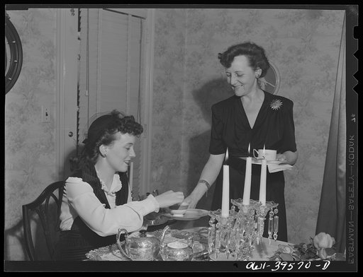 Washington, D.C. Members of the Woodrow Wilson High School sorority which Mary Spangler (standing) advises holding a tea at her home