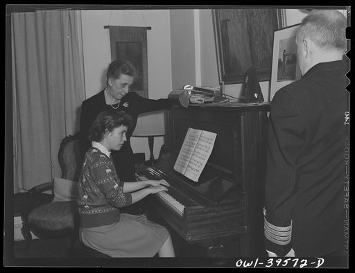 Washington, D.C. Sally Dessez, a student at Woodrow Wilson High School, playing the piano as her father and aunt listen