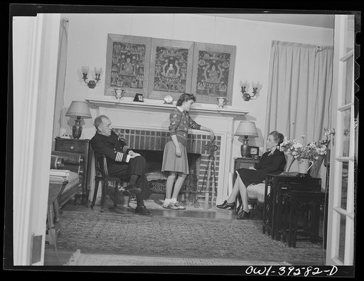 Washington, D.C. Sally Dessez, a student at Woodrow Wilson High School, with her father and aunt in the living room of their home