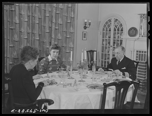 Washington, D.C. Sally Dessez, a student at Woodrow Wilson High School, having dinner at home with her father and her aunt
