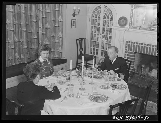 Washington, D.C. Sally Dessez, a student at Woodrow Wilson High School, having dinner at home with her father and her aunt
