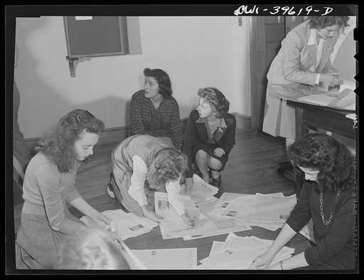 Washington, D.C. Members of the Woodrow Wilson High School newspaper staff folding the paper before distributing it