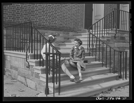 Washington, D.C. Sally Dessez eating lunch with a friend. They bring sandwiches from home and weather permitting, eat on the steps of the Woodrow Wilson High School