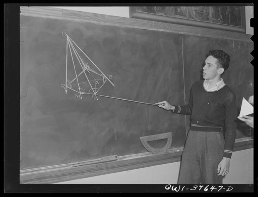 Washington, D.C. Walter Spangenberg (holding the pointer) giving a demonstration in geometry class at Woodrow Wilson High School