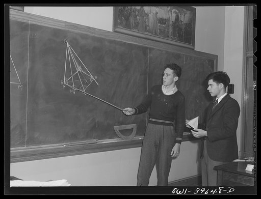 Untitled photo, possibly related to: Washington, D.C. Walter Spangenberg (holding the pointer) giving a demonstration in geometry class at Woodrow Wilson High School