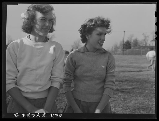 Washington, D.C. Sally Dessez (right), a student at Woodrow Wilson High School, watching a hockey game