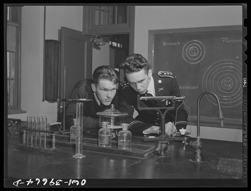 Washington, D.C. Walter Spangenberg a student at Woodrow Wilson High School, working in the chemistry laboratory. When the cadets drill, he wears his uniform all day