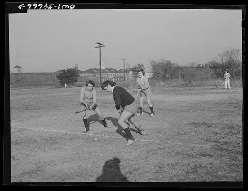 Washington, D.C. Sally Dessez (on the left), a student at Woodrow Wilson High School, playing hockey