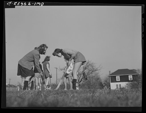 Washington, D.C. Sally Dessez (in shorts), a student at Woodrow Wilson High School, practicing before going into a hockey game