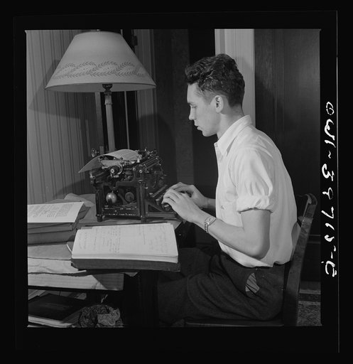 Washington, D.C. Walter Spangenberg, a student at Woodrow Wilson High School, doing his school work at home