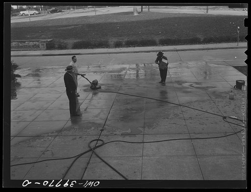 Untitled photo, possibly related to: Washington, D.C. The custodial force cleaning the Woodrow Wilson High School sidewalk of the red paint applied by students of a rival school before a football game