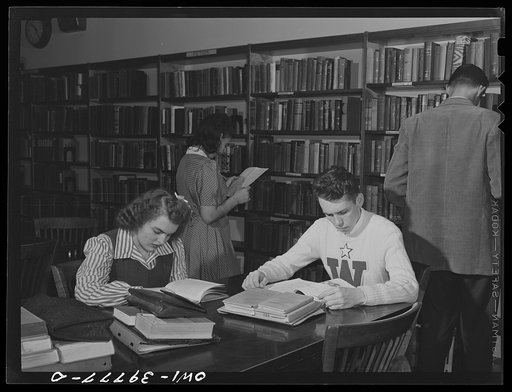 Washington, D.C. Walter Spangenberg (in white sweater) studying in the library at Woodrow Wilson High School