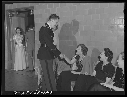 Washington, D.C. Walter Spangenberg and his date greeting the faculty chaperones at the regimental ball held at Woodrow Wilson High School