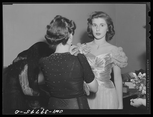 Washington, D.C. A Woodrow Wilson High School faculty member pinning a corsage for a student at the regimental ball