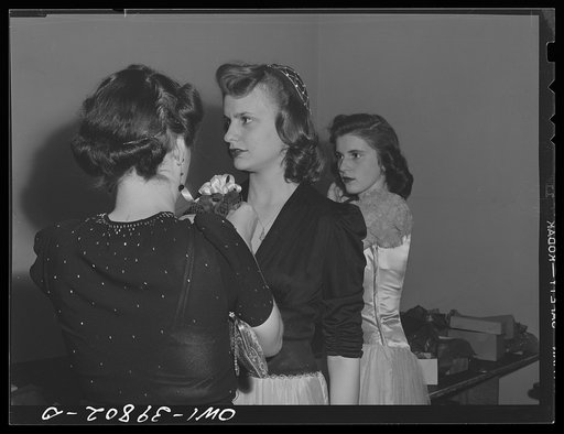 Washington, D.C. A Woodrow Wilson High School faculty member pinning a corsage for a student at the regimental ball