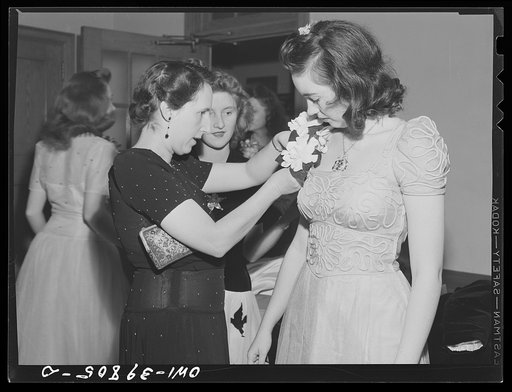 Washington, D.C. A Woodrow Wilson High School faculty member pinning a corsage for a student at the regimental ball