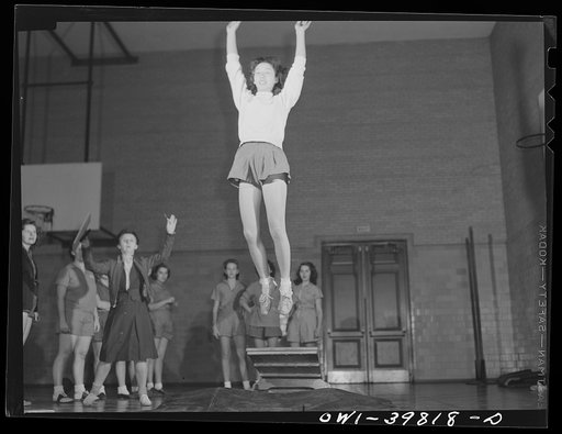 Washington, D.C. Physical education class doing mass exercises in the gymnasium at Woodrow Wilson High School