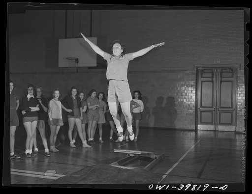 Washington, D.C. Physical education class doing mass exercises in the gymnasium at Woodrow Wilson High School