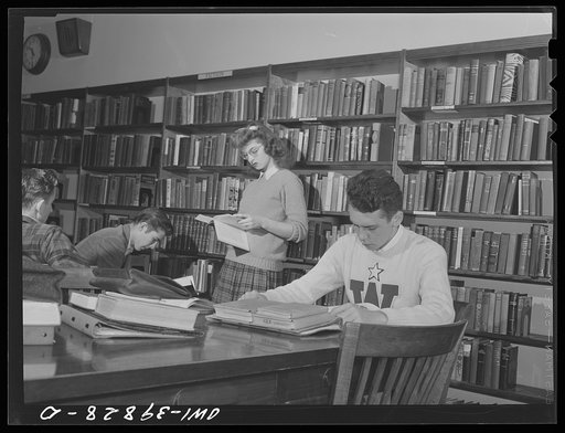 Washington, D.C. Walter Spangenberg (in white sweater) studying in the library at Woodrow Wilson High School
