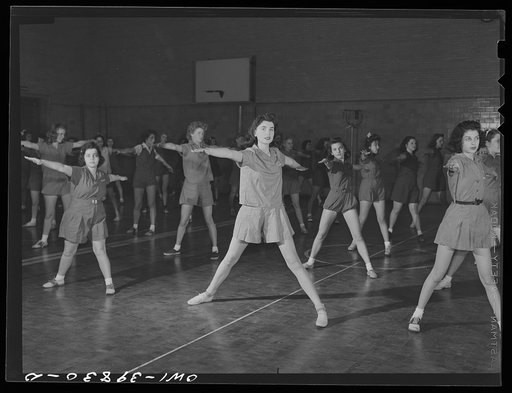 Washington, D.C. Physical education class doing mass exercises in the gymnasium at Woodrow Wilson High School