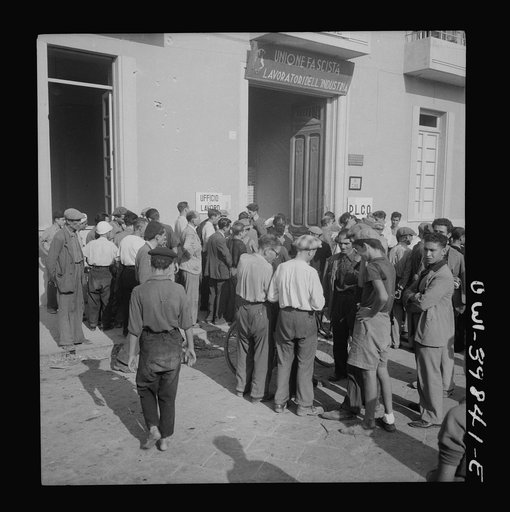 Messina, Sicily. Workers outside the labor office where both skilled and unskilled are given assignments for the day