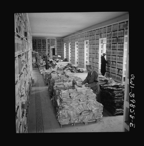 The 2,000-year-old Sicilian state library, parts of which was badly bombed. The Allied military government is working to keep all possible records intact