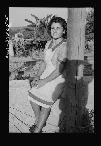 Sicilian girl who tends the gates at the railroad crossing