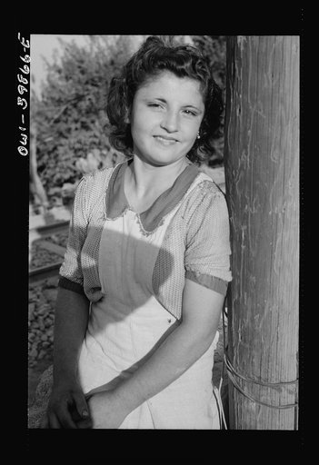 Sicilian girl who tends the gates at the railroad crossing
