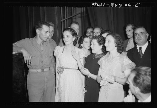 Palermo, Sicily. Allied soldiers and local girls at concert given by the Palermo symphony orchestra
