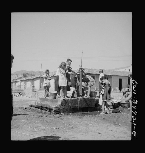 Sicilians drawing water from the town fountain