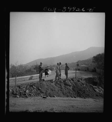United States road builders in Sicily at a bridge blown up by the retreating Germans