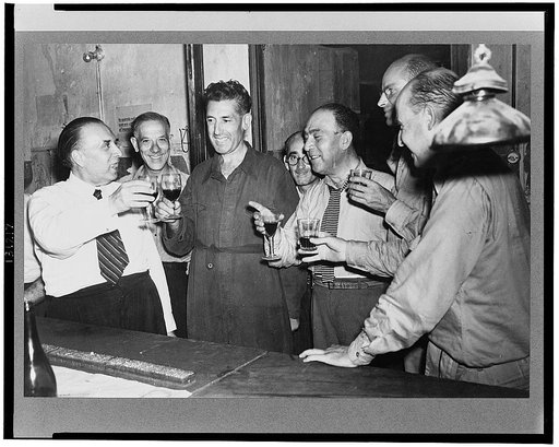Sicilians drinking wine at a bar
