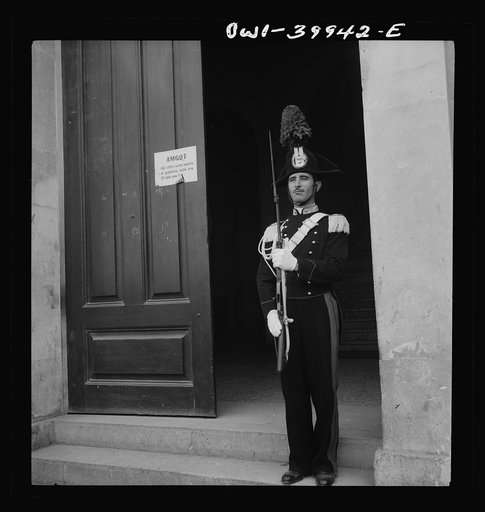 Italian National Police on guard outside an Allied military government office in Sicily