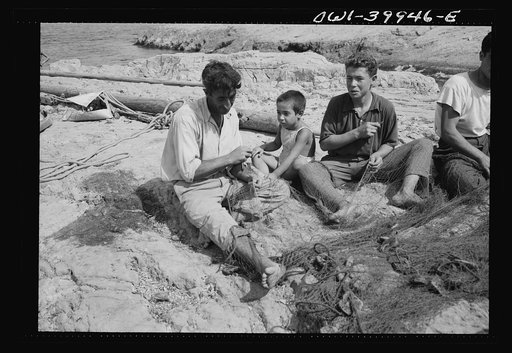Palmero (vicinity), Sicily. A family repairing nets